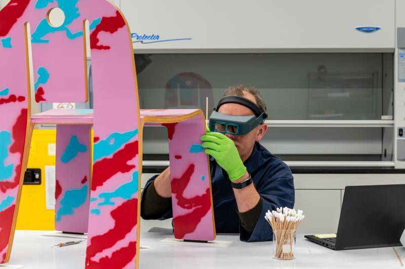 Conservator at work in a museum lab