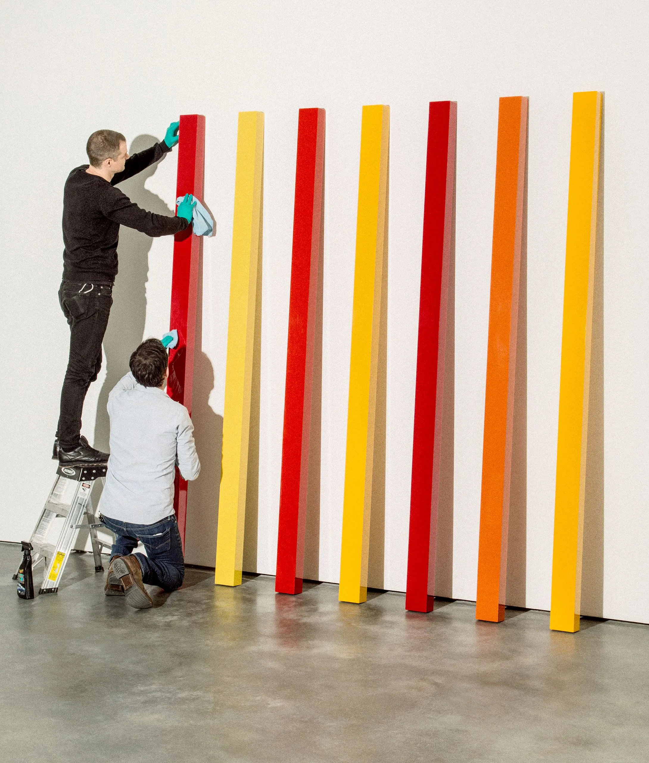 Veteran installing a colorful art exhibit